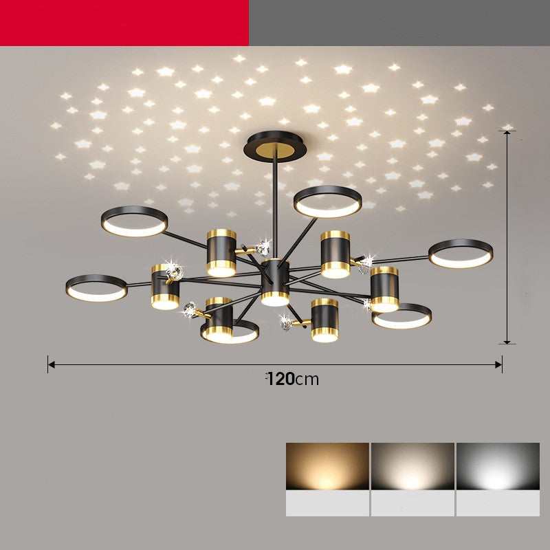 Modern chandelier with black and gold design on a gray background