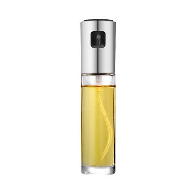 Spray bottle with yellow liquid on a white background