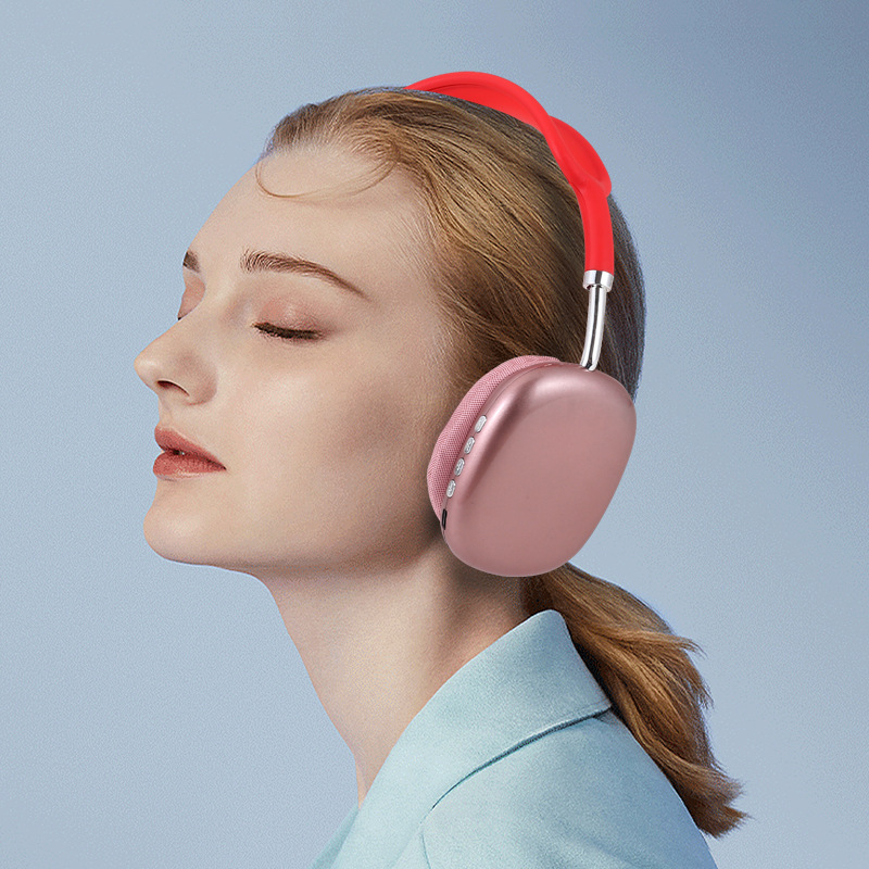 Person wearing pink headphones with a red headband on a light blue background