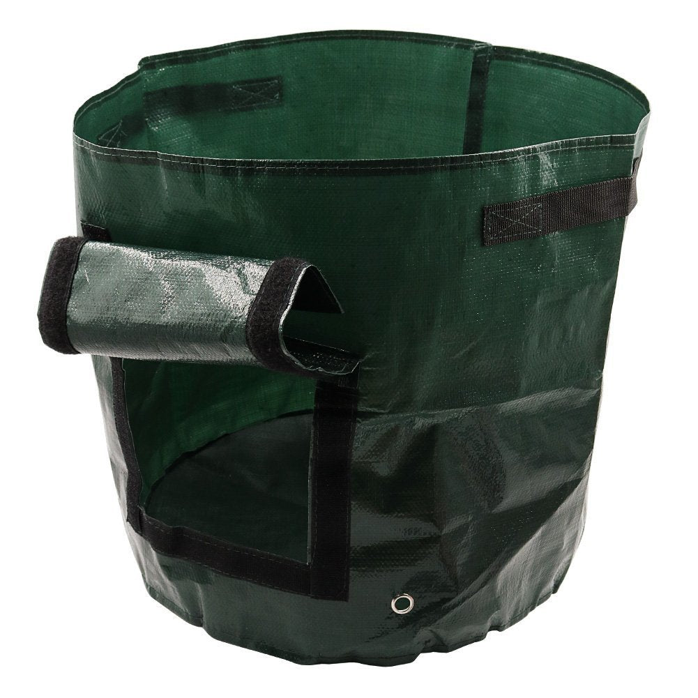 Green garden trash bag with black handles on a white background