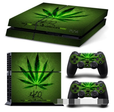 Gaming console and controllers with green cannabis leaf design on a white background