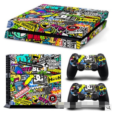 Gaming console and controllers with colorful graffiti-style skin design.
