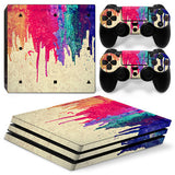 Gaming console and controllers with colorful abstract skin design on a white background