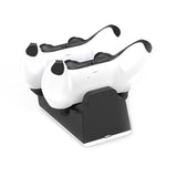 White VR headset with black controllers on a charging stand against a white background