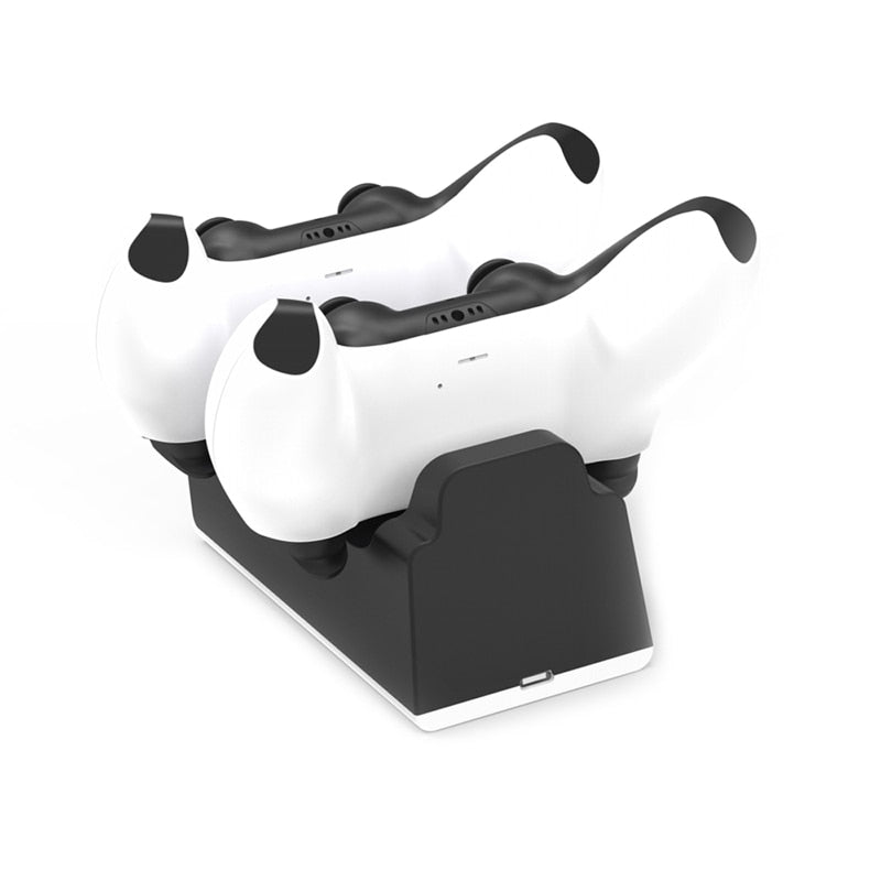 White VR headset with black controllers on a charging stand against a white background