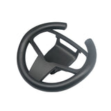Black steering wheel attachment on a white background