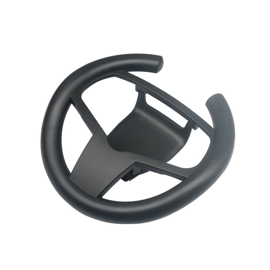 Black steering wheel attachment on a white background