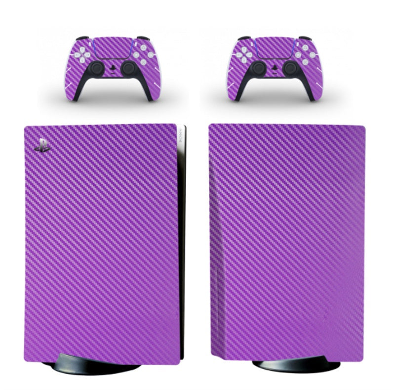 Purple carbon fiber patterned skin for gaming console and controllers on a white background