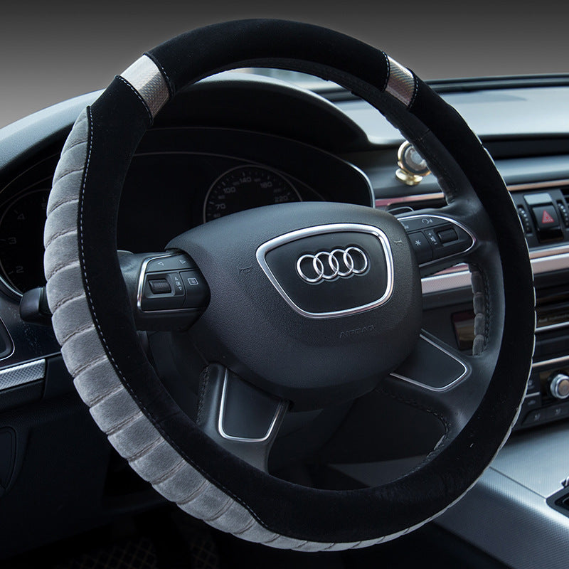 Steering wheel of an Audi car with a black and gray cover
