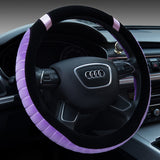 Steering wheel cover with purple trim on an Audi steering wheel