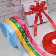 Handmade decorative bows featuring classic polka dot patterns on premium grosgrain ribbon for gift wrapping and accessories