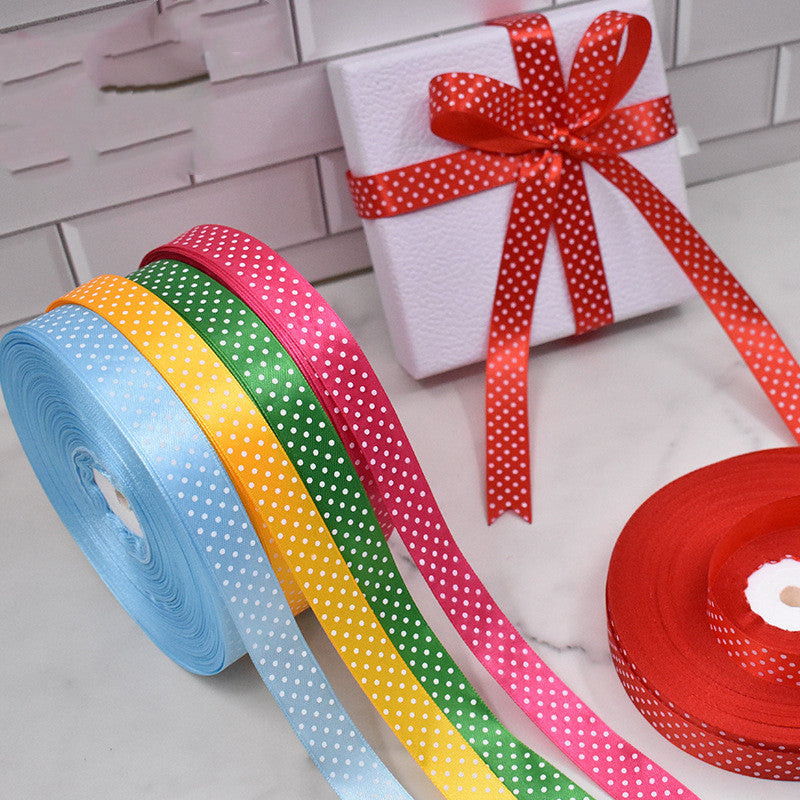 Handmade decorative bows featuring classic polka dot patterns on premium grosgrain ribbon for gift wrapping and accessories