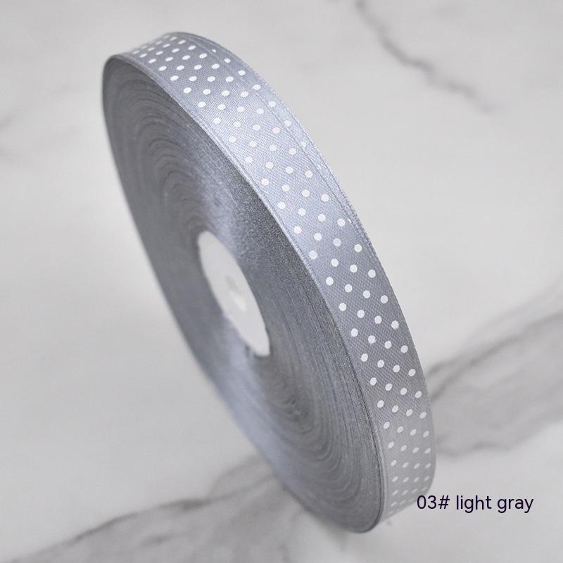 Handmade decorative bows featuring classic polka dot patterns on premium grosgrain ribbon for gift wrapping and accessories