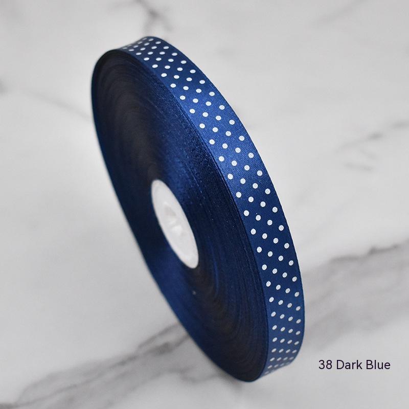 Handmade decorative bows featuring classic polka dot patterns on premium grosgrain ribbon for gift wrapping and accessories