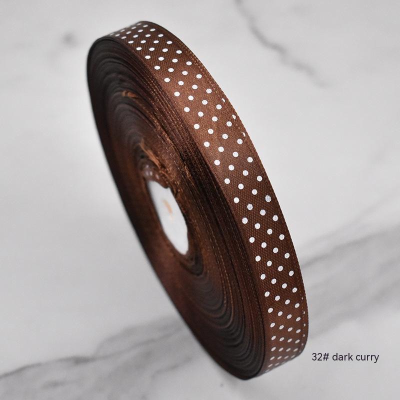 Handmade decorative bows featuring classic polka dot patterns on premium grosgrain ribbon for gift wrapping and accessories