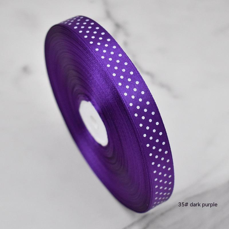 Handmade decorative bows featuring classic polka dot patterns on premium grosgrain ribbon for gift wrapping and accessories