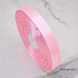 Handmade decorative bows featuring classic polka dot patterns on premium grosgrain ribbon for gift wrapping and accessories
