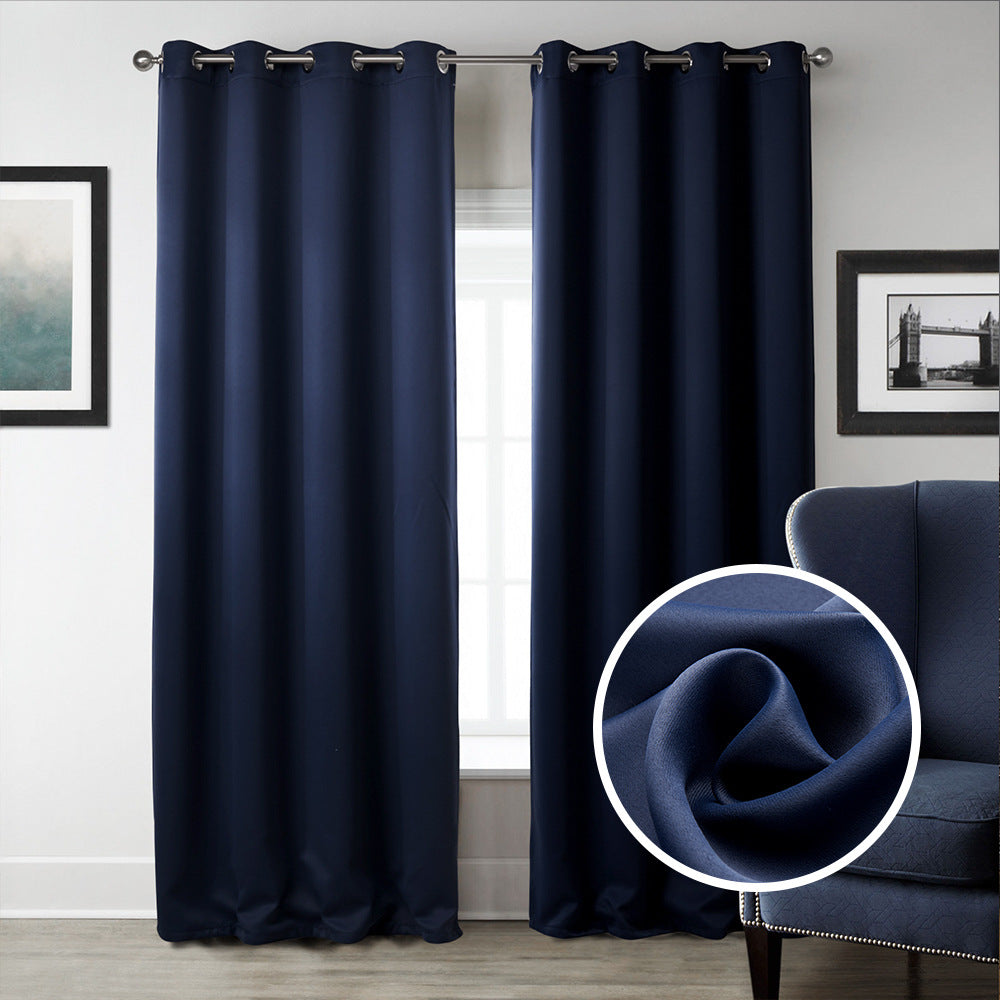 Navy blue curtains with a close-up of fabric texture in a room setting.