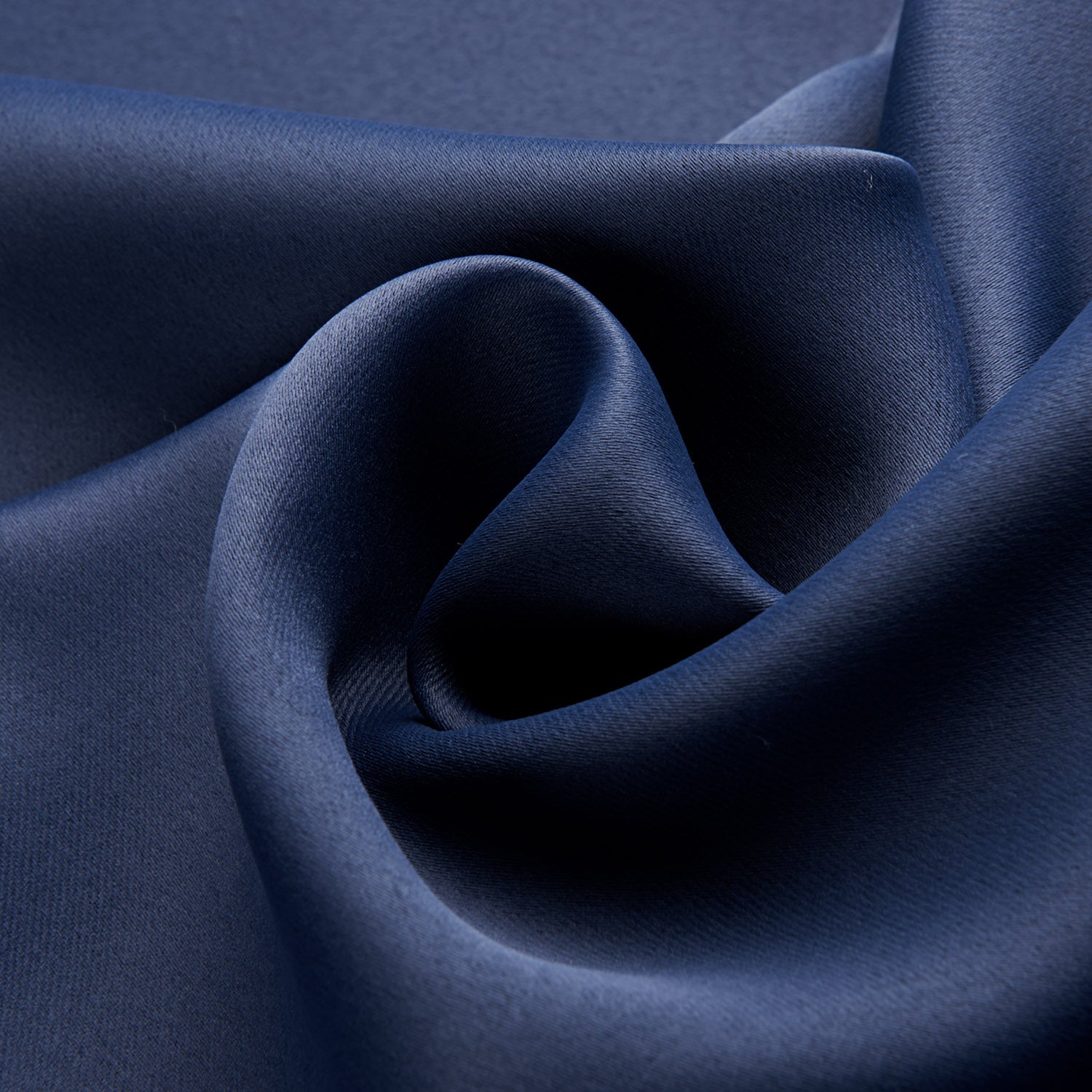 Close-up of dark blue fabric with folds