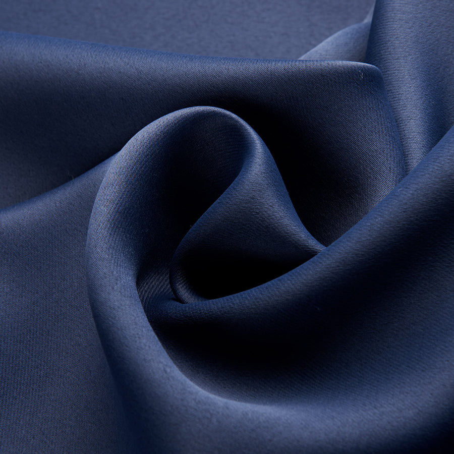 Close-up of dark blue fabric with folds