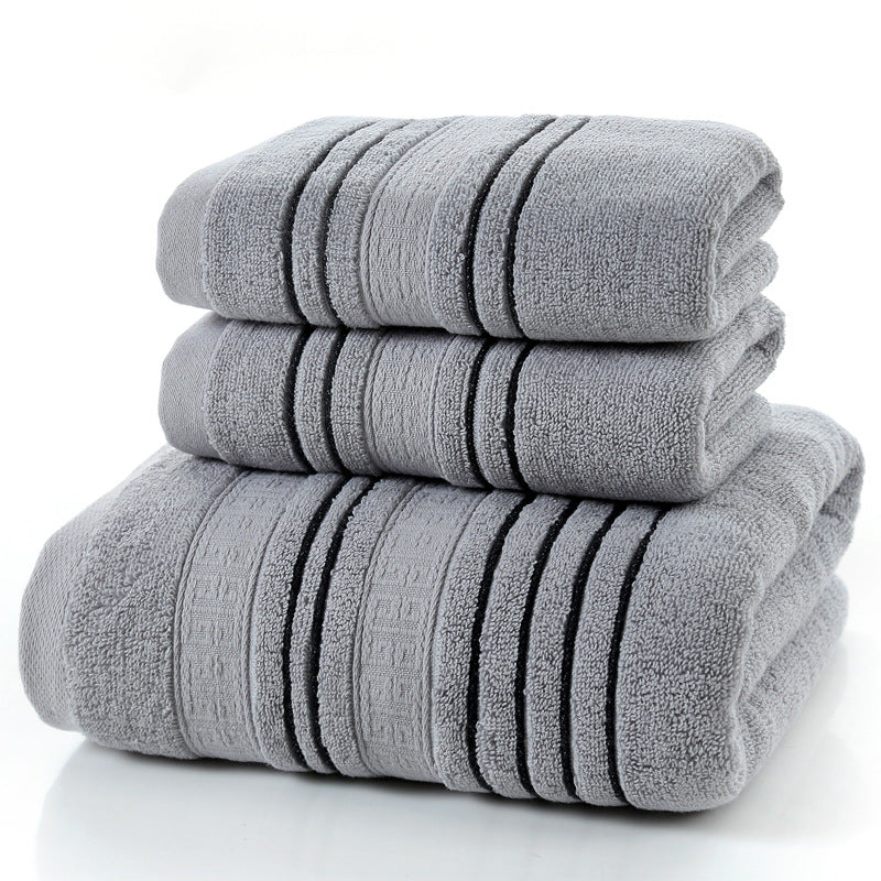 Stack of gray towels with black stripes on a white background