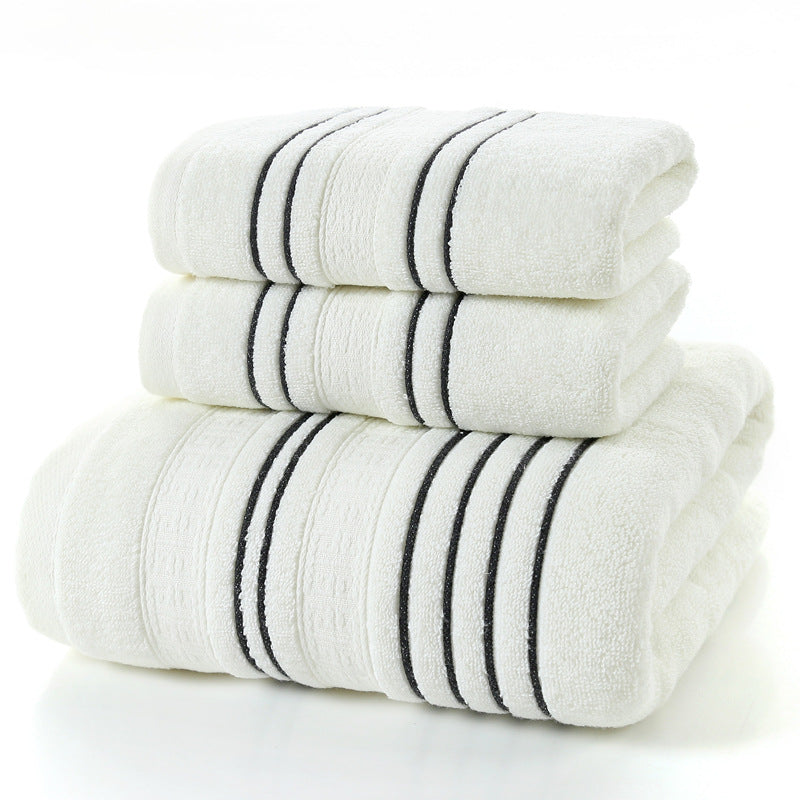 Set of white towels with black stripes on a white background