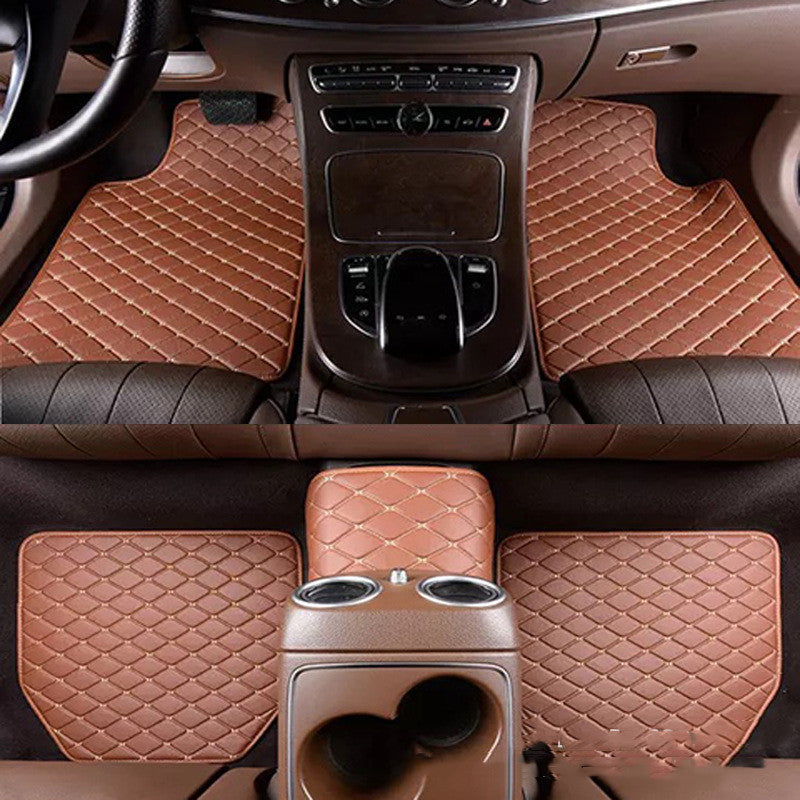 Brown car floor mats with diamond pattern on a car interior.