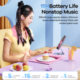 Woman using earbuds with a smartphone, sitting at a table with a cupcake and juice, with text about battery life and features.