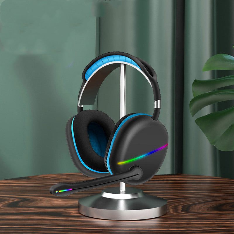 Gaming headset with RGB lighting on a stand against a green curtain background