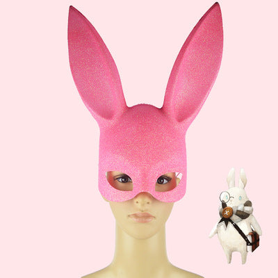 Pink bunny mask on a mannequin head with a pink background