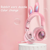 Pink headphones with bunny ears on a pink background