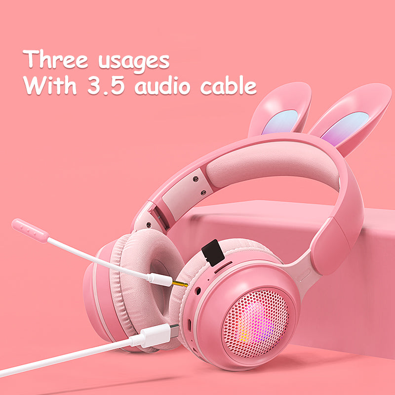 Pink headphones with bunny ears on a pink background