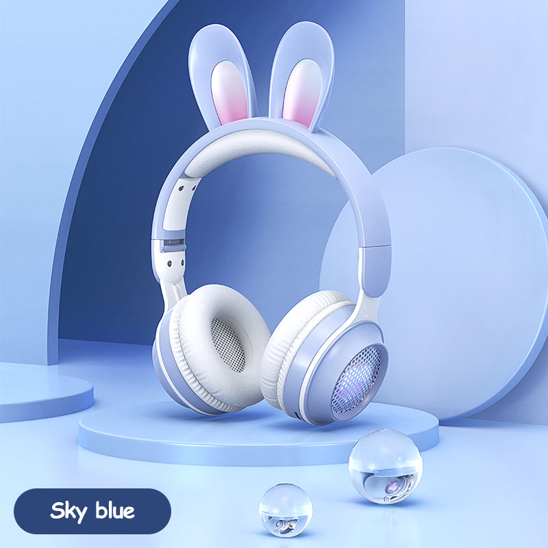 White headphones with bunny ears on a blue background