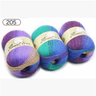 Three balls of yarn in purple, blue, and green with 'Real line' labels on a white background.