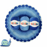 Three skeins of blue yarn in a crochet basket with 'Rainbow' label on a white background.