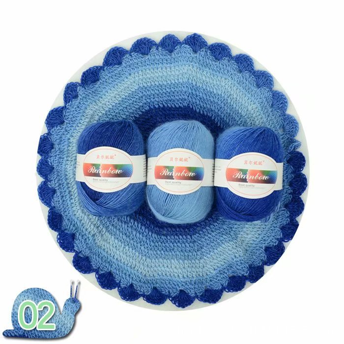 Three skeins of blue yarn in a crochet basket with 'Rainbow' label on a white background.