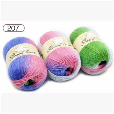 Four balls of yarn in pink, blue, green, and white with 'Floral Line' labels on a white background.