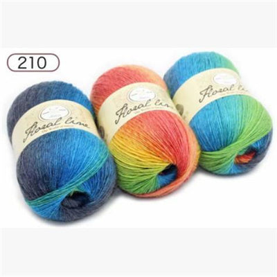 Three balls of colorful yarn with labels on a white background