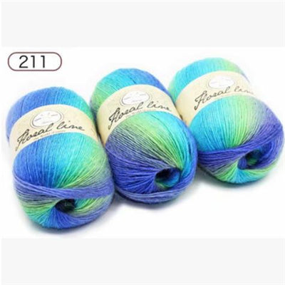 Three skeins of blue and green yarn with 'Great Line' labels on a white background.