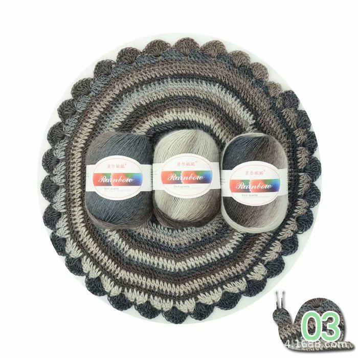 Round crochet mat with three balls of yarn on a white background
