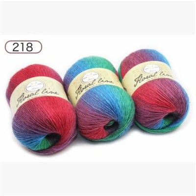 Four colorful yarn balls with labels on a white background