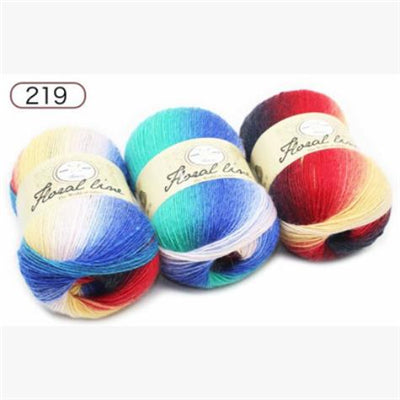 Four colorful yarn balls with 'Royal Time' label on a white background