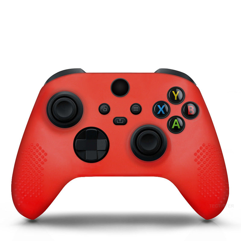 Red gaming controller with black buttons on a white background