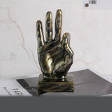 Bronze hand sculpture on a white background