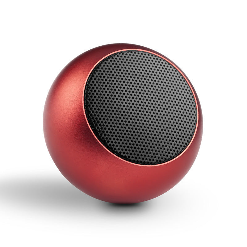 Red spherical speaker with black mesh on a white background