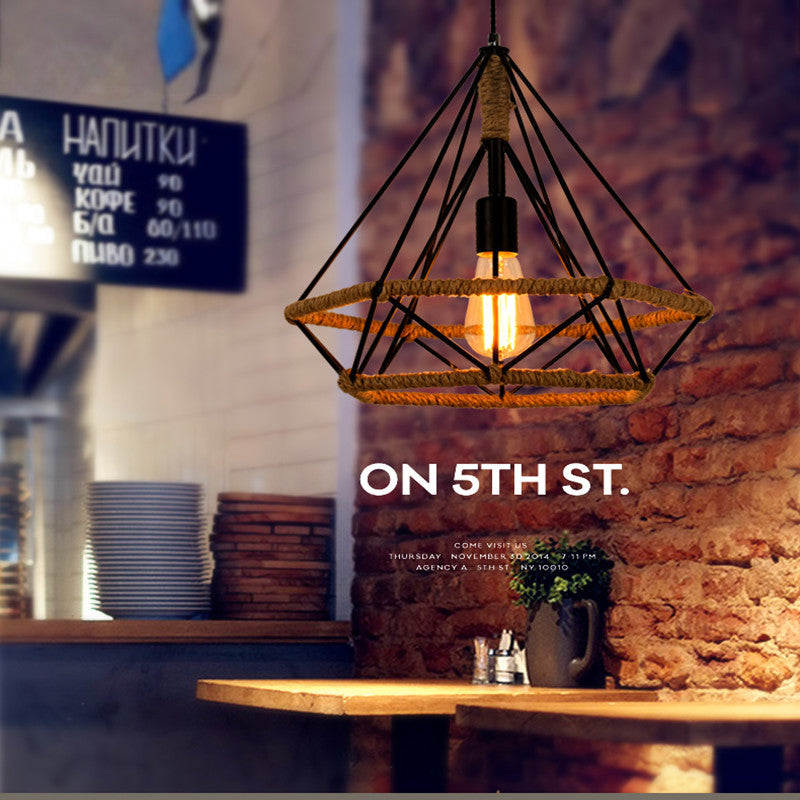 Industrial-style pendant light hanging in a cozy cafe setting with 'ON 5TH ST.' branding.