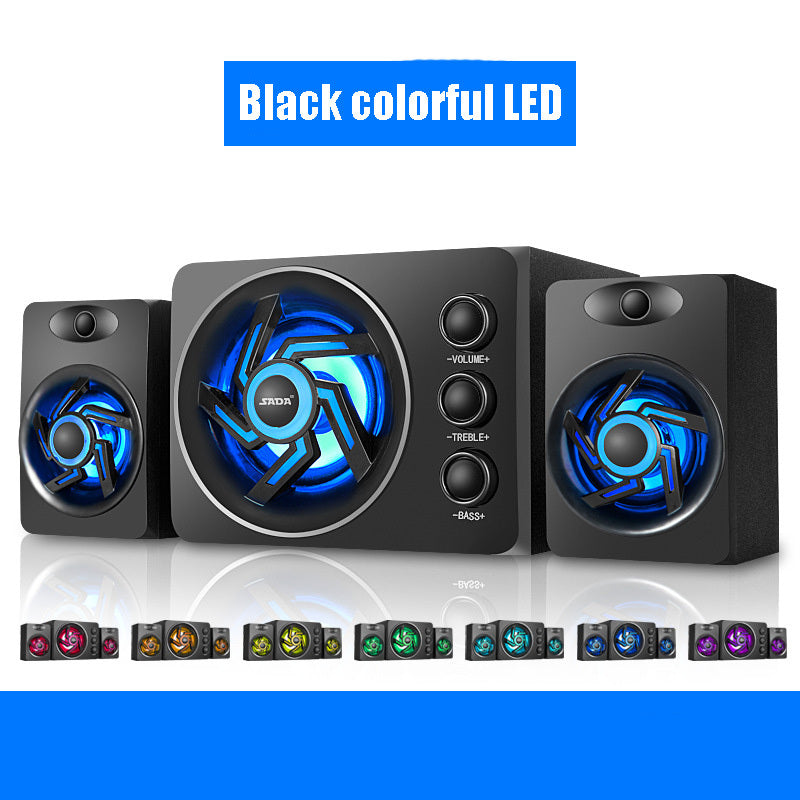 Black computer speakers with colorful LED lights on a white background