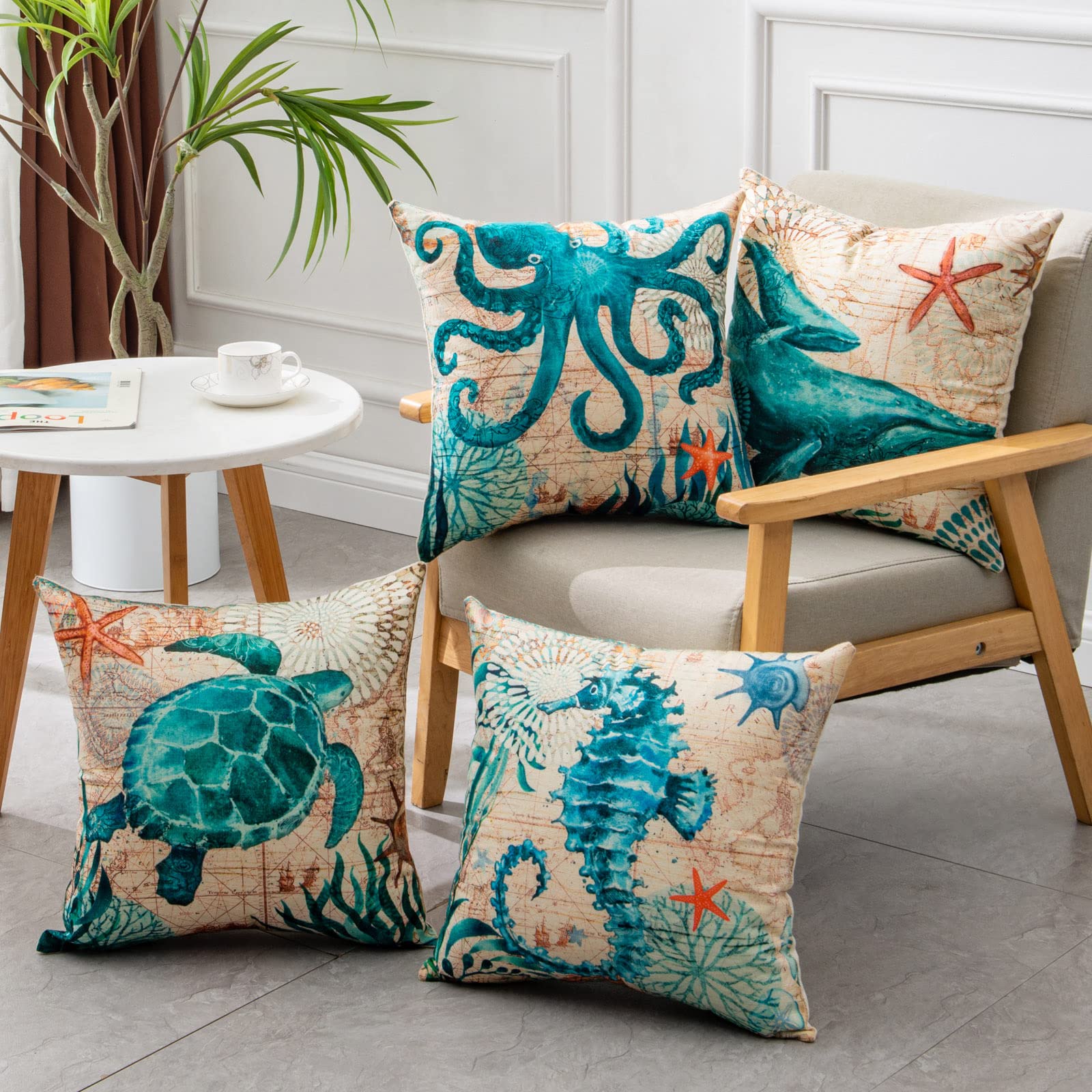 Decorative pillows with ocean-themed designs on a couch in a living room setting.