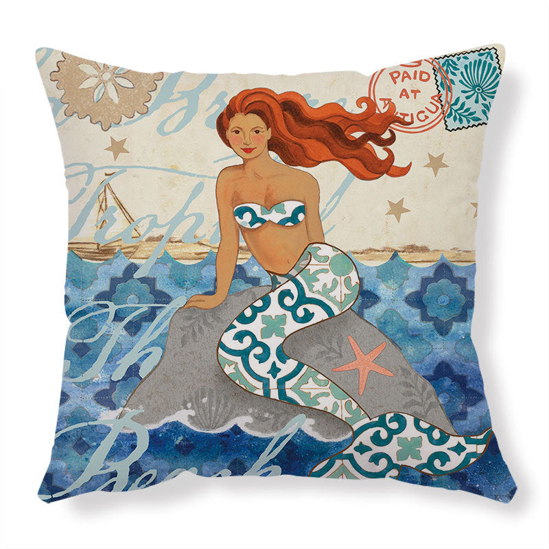 Decorative pillow with a mermaid design on a white background