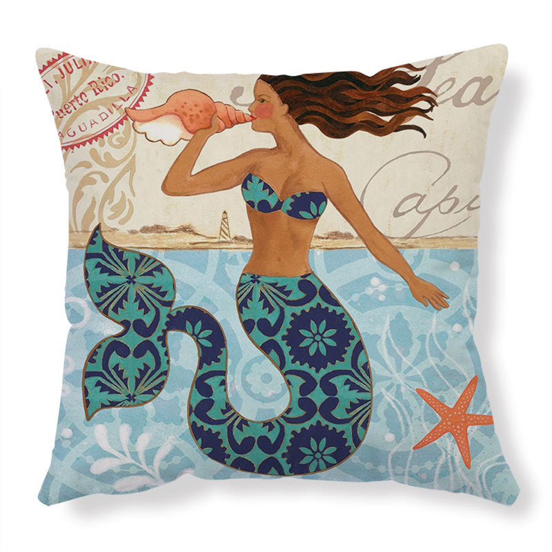 Decorative pillow with mermaid design on a white background